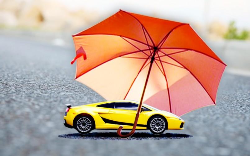 car protected by umbrella