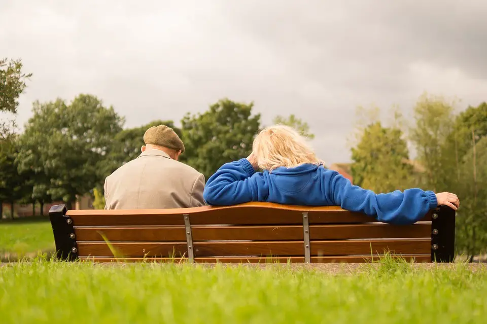 old couple on park bench
